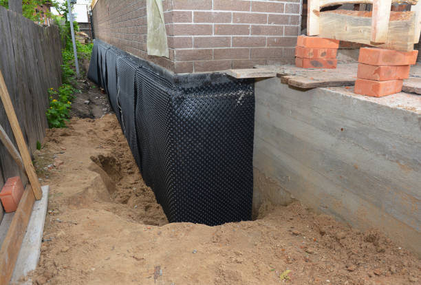 SJ Waterproofing Pros technician performing targeted Foundation Crack Repair assessment in Pioneer, TN